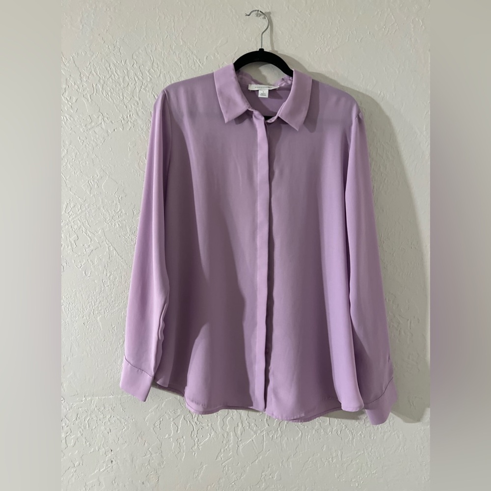 A little sheer lavender color blouse is like a purple pink color